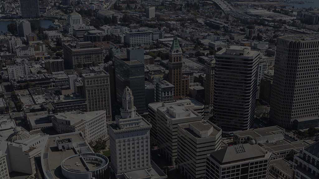 an aerial view of a city with tall buildings