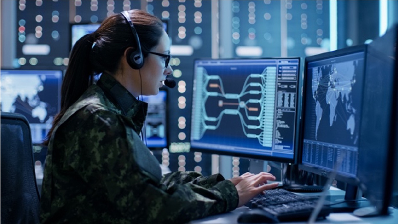 a woman in a military uniform using a computer